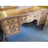 Circa 1900 a Queen Anne style dressing table with central drawer flanked by six short drawer on