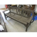 A modern teak garden bench, 32 1/2"h x 62 1/2"w