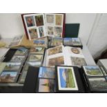 A group of nine postcard albums containing various postcards depicting topographical scenes of