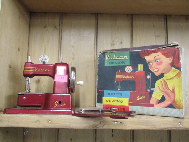 A retro Vulcan Senior child's sewing machine in red, boxed