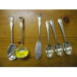 Silver coloured metal to include three matching servers, comprising a sauce ladle, a butter knife