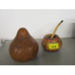A South American gourd with engraved decoration, along with a later bowl and pipe