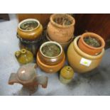 A collection of terracotta and pottery garden planters, together with two flagons