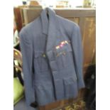 A military RAF jacket and trousers, together with an overcoat and a sweetheart brooch