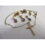 Gold and yellow metal to include earrings, a necklace and a cross pendant