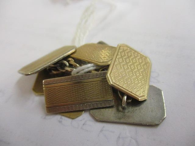 A pair of 9ct gold and a pair of silver cufflinks