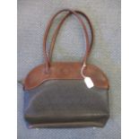 A Mulberry black and brown leather handbag with tartan interior