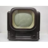 A 1953 Bush radio television receiver TV12AM in a brown Bakelite case, 15" h, 15" w