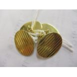 A pair of 18ct gold cufflinks with engine turned decoration