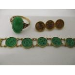 Chinese gold jewellery comprising an 18ct gold bracelet made from twelve carved and pierced jade