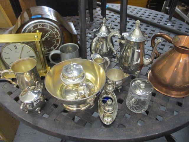 A mixed lot to include two clocks, a Victorian copper jug and mixed silver plate