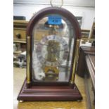 A modern Franz Hermle mahogany cased mantel clock, 13"h