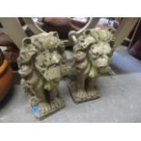 A pair of composition stone garden model lions, 18"h