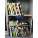 A selection of books to include racing books, car books, Readers Digest, Atlas and others