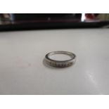 A 9ct white gold and diamond set half eternity ring