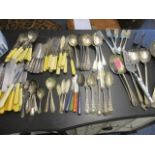 Mixed cutlery to include silver plated spoons and silver handled butter knives