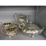 A matched four piece melon shaped teaset with shell feet