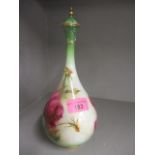 A Royal Worcester Hadley bottle vase and cover decorated with roses, 9 1/2" h