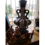 A large retro continental, twin handled pottery lamp, Wade piggy banks and other ceramics