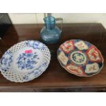 A Meissen Onion pattern plate, a Victorian blue glass jug and a Japanese Imari plate