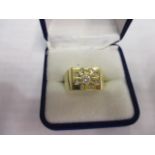 An 18ct gold gentleman's ring set with nine diamonds