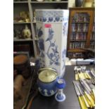 A modern blue and white oriental inspired umbrella stand, a Wedgwood ginger jar with silver plated