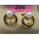 A pair of Linneys 18ct yellow gold ear clips set with natural forming pearls and single champagne