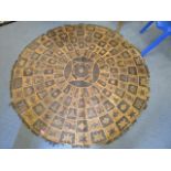 A West African animal skin mat, 65" diameter