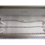 A white gold coloured metal necklace and matching bracelet, stamped 9kt