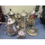 Silver plate to include a three piece teaset, two coffee pots and a candlestick