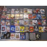 A Playstation games console, two controllers and approximately 40 PS2 games and others