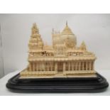A 20th century carved and fretwork balsa wood model of a temple with a turret and arched entrance,