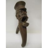 An early 20th century German, Black Forest carved nutcrackers fashioned as the head of a man with