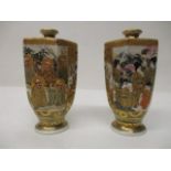 A pair of early 20th century Japanese Satsuma, hexagonal vases decorated with panels of men and