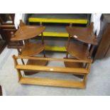 A pair of Ercol three tier what-nots, together with a light Ercol wall hanging shelf