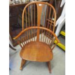 A modern elm and beech spindle back rocking chair