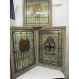 Three 19th century stained glass windows, one with an Armorial shield and ribbons in green, red