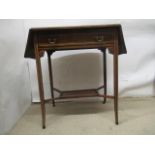 A late Victorian string inlaid, rosewood and marquetry occasional table with twin fall flaps and a