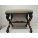 A William IV rosewood stool having an upholstered top, on carved, scrolled double S shaped ends,