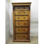 A Victorian rosewood Wellington chest having six graduated drawers and a lockable flank, on a