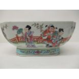 A 20th century Chinese famille rose bowl of square form with inverted corners, on a splayed foot,