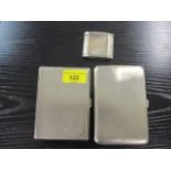 Two silver cigarette cases 325g, and a Pilgram silver plated lighter