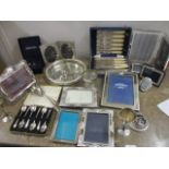 Silver plate to include various photograph frames, cutlery, coasters, a tray and other items