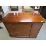 A Victorian mahogany chest of two short and two long drawers on replacement bun feet