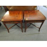 A pair of reproduction mahogany side tables with a single drawer on square tapering legs, cross