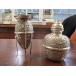 Two Egyptian embossed silver pots and covers with floral ornament