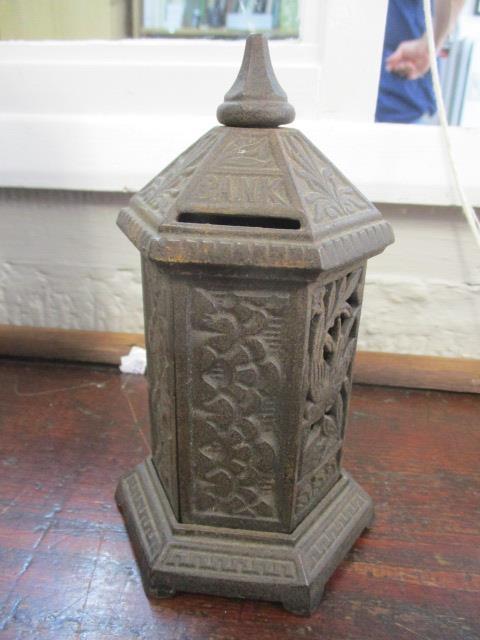 A Victorian moneybox in the form of a letter box