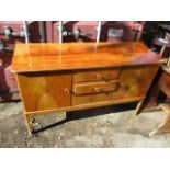 A Gordon Russell of Broadway, a mid 20th century teak sideboard with two cupboards, flanking three