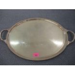 A silver plated oval, twin handled tray with a gadrooned edge