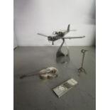 A 925 silver model of an aeroplane on stand, a white metal miniature microphone on stand and a white